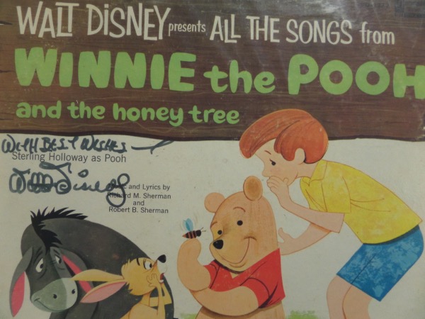 This original 1965 "Walt Disney Presents All Time Songs From Winnie the Pooh and the Honey Tree" LP album is still in EX condition overall, and comes front cover-signed in black felt tip marker by Mr. Disney himself.  The signature grades a legible 7.5, with With Best Wishes included, and the album includes a photo LOA from ROC Memorabilia for authenticity purposes.  Valued into the low thousands!