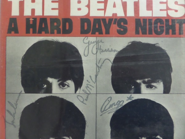 This original Capitol Records release of the "A Hard Day's Night" soundtrack is in EX overall condition, and comes front cover-signed in black felt tip marker by all four band members.  Included are Paul McCartney, George Harrison (dec), John Lennon (dec) and Ringo Starr and with all four autographs present, this should make for a true jewel for any Beatles collection!  ROC Memorabilia photo COA included for authenticity purposes!