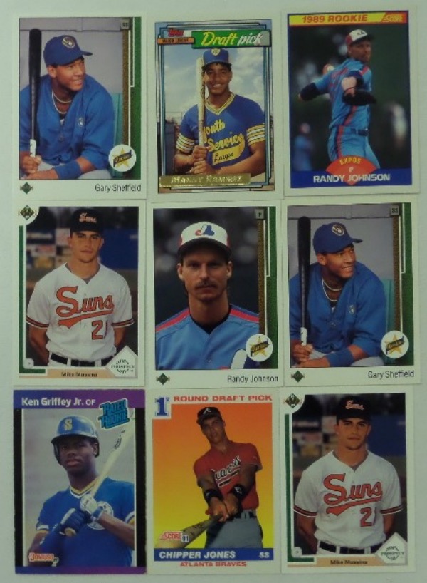 This collection of late 1980's to early 1990's rookie baseball cards is ideal for the current market, and includes the following: a 1989 Donruss Rated Rookie Ken Griffey Jr. card, a 1991 Upper Deck Chipper Jones, (2) 1991 Upper Deck Mike Mussina, a 1989 Upper Deck Randy Johnson, (2) 1989 Upper Deck Gary Sheffield, a 1992 Topps Manny Ramirez GOLD card, and a 1989 Score Randy Johnson.  These cards are all NM or better, with the exception of the Griffey card, which shows some edge wear, but is otherwise very nice.  Total retail value here is low thousands, easily!