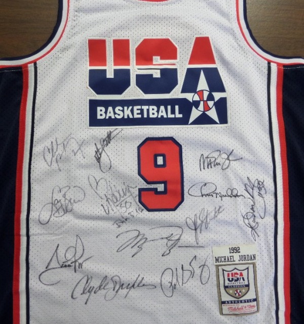 This white size 52 Mitchell & Ness #9 USA Basketball Michael Jordan jersey is in NM/MT condition, with everything sewn, and comes front signed in black sharpie by by all 12 members of the original Dream Team!  Included are Bird, Magic, Jordan, Barkley, Ewing, Drexler, Robinson, Malone, Stockton, Pippen, Laettner and Mullin, and this AWESOME and one of a kind display item books well into the low thousands!
