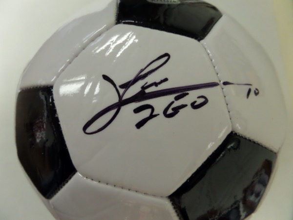 This mint Champion soccer ball is white with black trim and comes signed by the best ever in black with his #10 and "LEO" included!! Guaranteed authentic and comes hologrammed and ready for display for the soccer collector. Retails in the mid-high hundreds. 