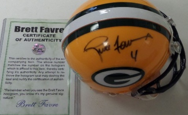 This yellow Green Bay Packers mini helmet from Riddell is still in NM condition, and comes hand-signed in black sharpie by the HOF passer and Super Bowl Champion himself.  Signature grades about an 8 overall, and the helmet includes a COA and hologram from his own "Favre 4" authentication company (87883).  Valued well into the hundreds!