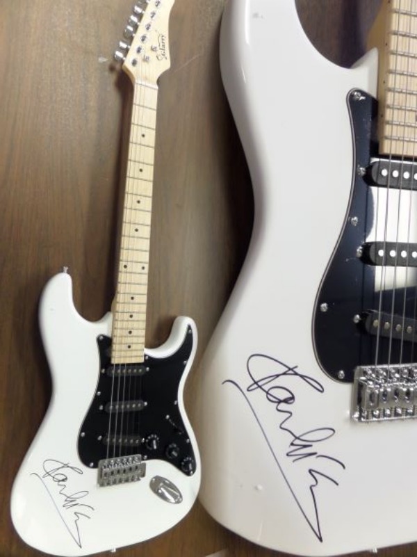 This gorgeous white electric Glarry guitar comes with the original box, pick ups, bag, straps,etc. and comes signed by the best singer/songwriter of all time in black. SUPERB autograph and shows off wonderfully. Guaranteed authentic and get it now because Paul is a tough autograph and not getting any younger! 