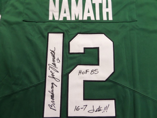 This green size L custom New York Jets #12 Namath football jersey is in NM/MT condition, and comes trimmed in black and white, with everything sewn.  It is back number-signed in black sharpie by the MVP of Super Bowl III himself.  The signature grades an overall 8, signed Broadway Joe Namath, with HOF '85 and 16-7 Jets!!! inscriptions.  Valued into the high hundreds!