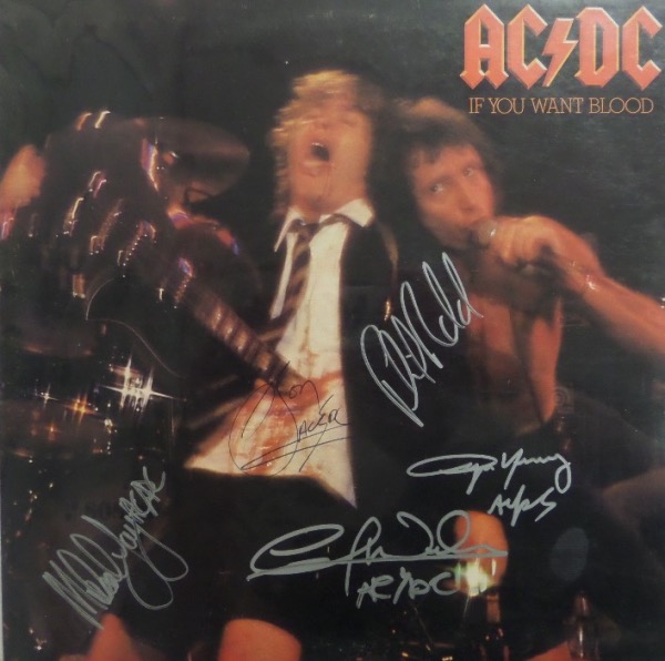 This original 1978 "If You Want Blood, You Got It" LP album from Aussie rockers AC/DC is still in really good, EX shape, especially considering that it's 44 years-old.  Hey, lots of things make it 44 years, but y'know, Bon Scott didn't, and his autograph is on this baby!  He is in black ink, and the other four band members--they, being Angus, Malcolm, Phil and Cliff--are all in silver.  A great looking album, and honestly, not one you see everyday, especially with the elusive Bon Scott present!