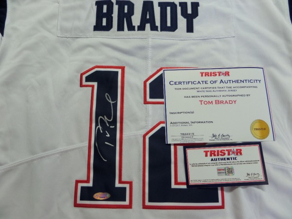 This mint New England home white is trimmed in team red and blue colors. It comes back #12 signed by the GOAT in bold silver sharpie, grades a superb 10 all over, and has the added Tri-Star paperwork, certs and lifetime holograms. Great buy and hold sports investment, and value is 4 grand all day long. 