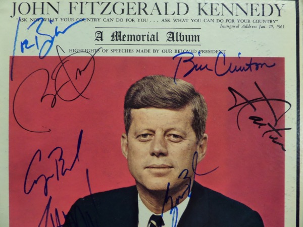 This original "John Fitzgerald Kennedy: A Memorial Album" is from the 1960's, and is still in EX shape overall, with a color image of JFK on the front cover.  It is hand-signed in blue and black felt tip marker by 7 men who have followed JFK as Commander In Chief, including Carter, Bush, Clinton, Bush, Obama, Trump and Biden--basically, the only ones left alive at this point, plus Bush 1 as a bonus.  Awesome Presidential collector's item, and retail is well into the thousands!