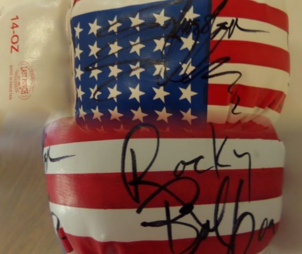This 14 ounce USA flag-style glove has laces and is mint! It comes signed perfectly by this aging legend in black with his character name "Rocky Balboa" included!  Perfect for display and retails in the high hundreds/low thousands. Guaranteed authentic. 
