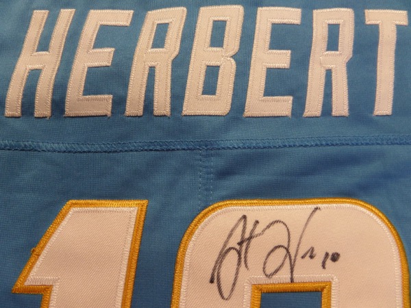 This GORGEOUS sky blue Chargers jersey is authentic and comes signed on the back numbers by this young star QB with his #10 included.  Shows off superbly and guaranteed authentic. He is 1 of the favorites for MVP this year and the Chargers are on the rise!