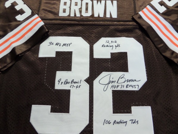 This brown size 50 custom 1964 throwback Cleveland Browns #32 Jim Brown jersey from Mitchell & Ness is in NM/MT condition, and comes with everything custom hand-sewn.  It is back number-signed in black sharpie by the greatest running back EVER, including 3X NFL MVP, 12, 312 Rushing Yds, 9X Pro Bowl 57-65, HOF71, ROY 57 and 106 Rushing TDs inscriptions!  Now THAT'S a rarity from the all time great, and the retail value of this jersey is high hundreds, and might even touch low thousands!