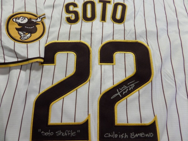This white, pinstriped size L San Diego Padres #22 Soto jersey is still tagged as new and comes with everything stitched.  It is back number-signed in silver by their newest addition, superstar outfielder, Juan Soto, and the signature grades a legible 8.5, with Childish Bambino and "Soto Shuffle" inscriptions.  A fantastic and brand NEW Padres item, and retail is low thousands right now!