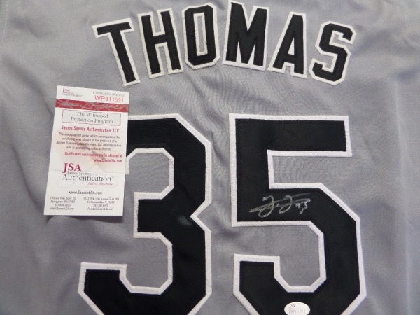 This road gray Chicago White Sox custom #35 Frank Thomas jersey is in NM condition, and comes with everything professionally-stitched.  It is back number-signed in silver by the 2 time AL MVP and HOF slugger himself, and comes fully JSA authenticated (WP311591) for certainty.  Valued into the high hundreds!