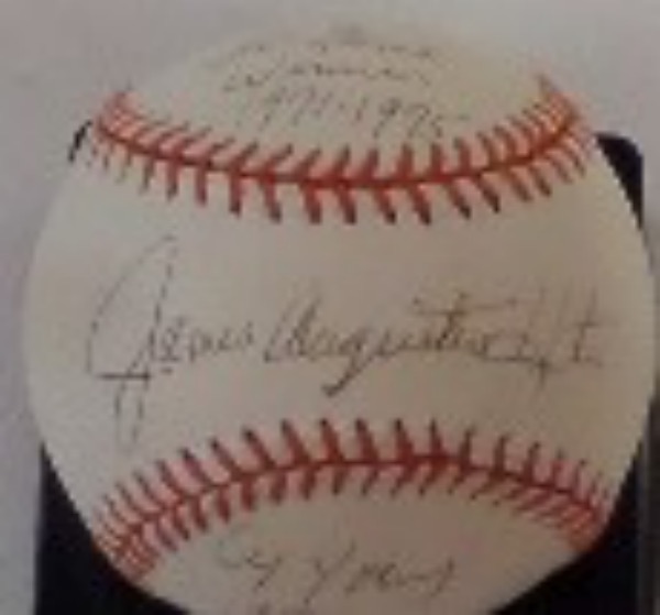 This NM Rawlings Off American League baseball is a commemorative Cal Ripken 2131 ball that is orange laced, and comes sweet spot signed in blue ink by the now deceased A's HOF righthander and '74 Cy Young Winner, Catfish Hunter.  The signature includes his nickname and a Perfect Game 5-8-68 inscription, and is a real beauty on this commemorative ball!