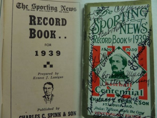 This vintage The Sporting News Record Book for 1939 commemorates the baseball centennial, with a photo of Abner Doubleday in the center.  It is in EX overall condition and completely intact, and though diminutive at only 3x5.5, it packs quite the punch, as it is black ink-signed on the front by 11 men who were original 1930's inductees to the Hall.  Included are Cobb, Ruth, Wagner, Johnson, Alexander, Mack, Lajoie, Speaker, Sisler, Collins and Young.  That is star power that goes beyond star power, and with everyone now deceased over a half century, retail is mid thousands!!!