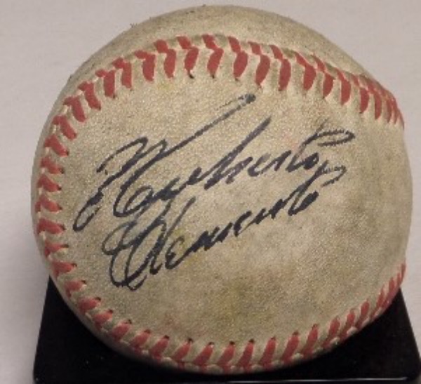 This vintage red-laced baseball is unmarked and in G+ condition and ready for display.  It is black ink-signed on a side panel by tragically deceased HOF Pirates immortal Roberto Clemente.  Signature is a strong 8 overall, but a fine example!  Valued well into the thousands!