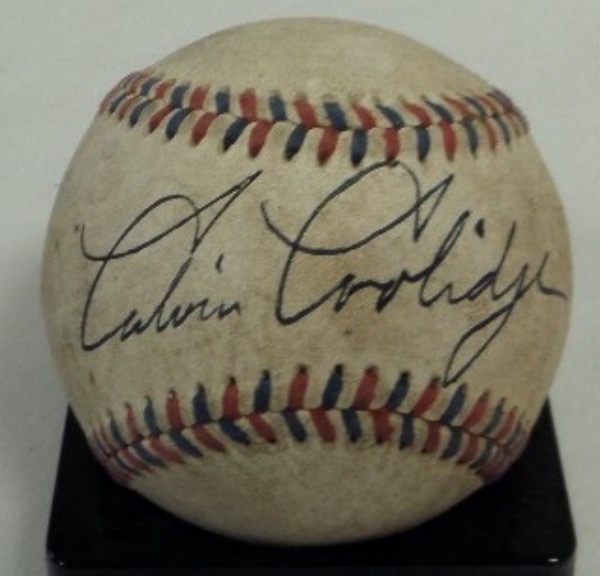 This vintage red and blue-laced baseball is in fabulous VG condition, especially considering its age.  It is hand-signed in black across the sweet spot by 30th United States President, Calvin Coolidge, and grades an overall 6.  A great looking, historic collector's baseball from "Silent Cal", and retail is well into the low thousands!
