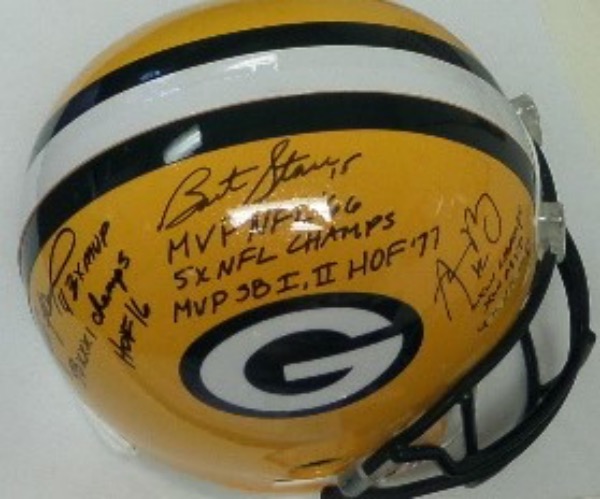 This full size replica Packers helmet from Riddell is in NM condition, and comes black sharpie signed by all three Super Bowl winning GB quarterbacks.  Included are Bart Starr (w/ MVP NFL '66, MVP SB I, II, 5X NFL Champions, and HOF '77 inscriptions), Brett Favre 3X MVP, HOF 16, & SB XXXI Champs!) and Aaron Rodgers (XLV MVP, XLV Champs and 4X NFL MVP), and the helmet is valued into the low thousands!