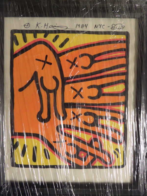 This bright framed work is NYC dated from 1984, and comes hand signed by the late artist. It shows his usual abstract scene with lots of yellow and orange color, and comes framed to about 10x12 in size. It has both Gallery stamps remaining on the back, as well as his family's "Authorized by the Estate" evident on the back for authenticity. Wow!