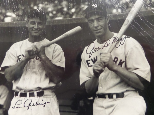 This black and white vintage 8x10 photo shows grizzled vet Lou Gehrig, posing with young buck Joe DiMaggio, sometime in the mid to late 1930's.  It is hand-signed in black fountain pen ink by both all time greats, with each signature grading a 7.5 or better.  Even if it were just DiMaggio alone on here it would be worth mid hundreds.  Gehrig too?  Now we're talking mid thousands!