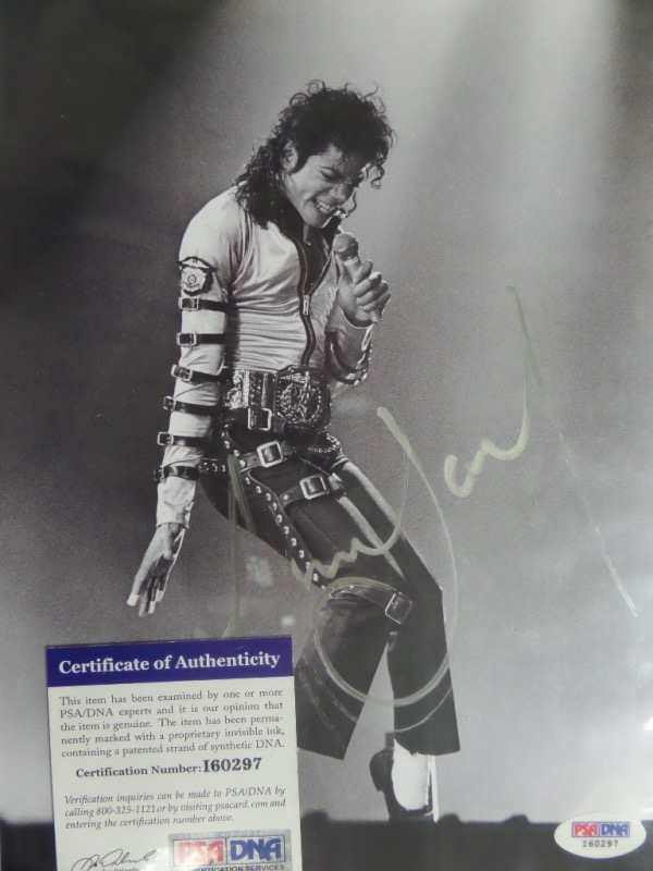 This black and white 7x11 photo is a stunning concert image of Michael Jackson performing for his adoring fans during a 1990's show.  It is hand-signed in silver sharpie by the King of Pop himself, grading about a 6.5-7, and comes fully PSA/DNA certified (I60297) for authenticity purposes.  With the supreme entertainer's death now approaching 15 years ago, retail is high hundreds!