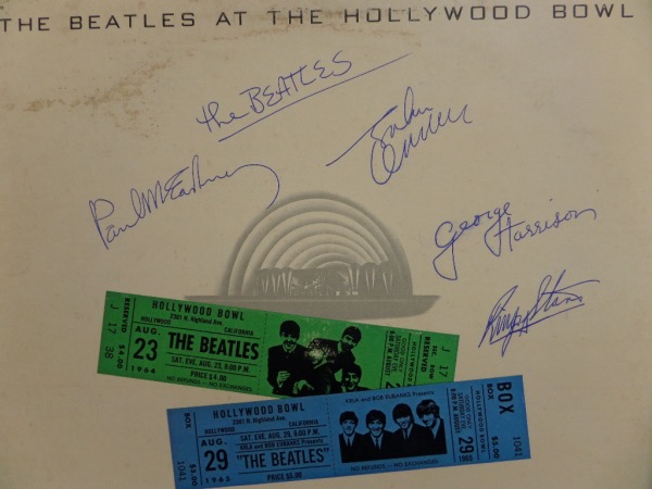 This original "The Beatles At The Hollywood Bowl" LP album is in EX+ condition and comes autographed by ALL FOUR members of the greatest band ever!  Included are Paul McCartney, Ringo Starr, George Harrison and John Lennon, all in blue ink, and all fantastic signatures, grading 8's or better against the light colored backing of the album cover.  Valued well into the hundreds!