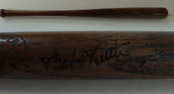 This approximately 16" mini bat from original bat craftsmen Hillerich and Bradsby is a deep dark wood, and is in EX shape. It comes barrel-signed in black ink by this HOF legend nicely and the grade is a decent, overall 6.  Super-high book value and a very rare gem from this superstar!