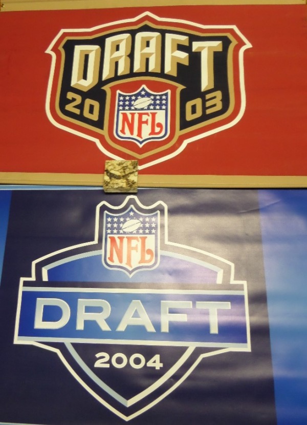 No serious football collection would be complete without these gorgeous and 100% authentic banners from the NFL Draft in Madison Square Garden.  Each measures a sizable 30" tall by 45" wide, and were actually used during the drafts.  There is a blue one from 2004 and a red one from 2003, and boy, will these pieces absolutely shine in your football collection, display, or man cave!