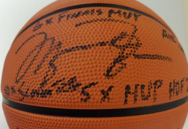 This Authentic Series basketball from Wilson is in MINT condition, and comes hand-signed in bold black sharpie by NBA All Time Great, Michael Jordan.  The signature grades a sharp, legible 9, including 6X Finals MVP, Air Jordan, 10X Scoring Title, 5X MVP and HOF 2009 inscriptions, and the ball is valued into the very high hundreds!