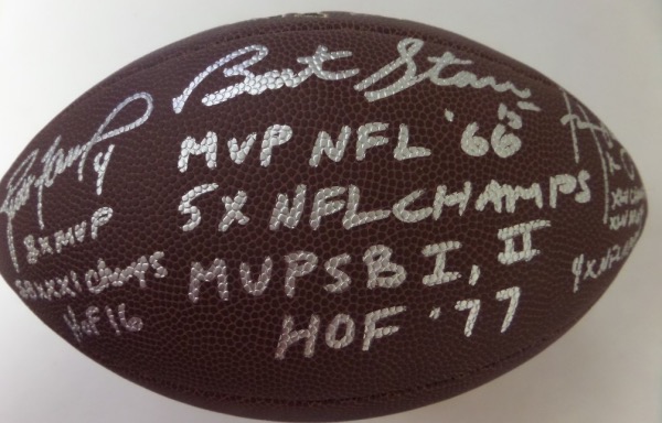 This full size football from Wilson is in EX/MT condition, and comes silver paint pen-signed by the three quarterbacks who have won a Super Bowl with the NFL's most storied franchise, the Green Bay Packers.  Included are Aaron Rodgers, Brett Favre, and Bart Starr, and all of the signatures reside on the same panel for optimum display.  Each QB has added a bevy of descriptions--please see our photo--and this unique item is valued into the high hundreds!