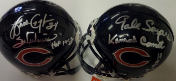 This 1990's style Chicago Bears mini football helmet from Riddell still has original tagging attached, and is in NM overall condition.  It is hand-signed in bright silver on one side by HOF running back, Gale Sayers, and on the other by HOF running back, Walter Payton, with each signature grading an 8.5 or better with inscriptions added.  With Payton now gone 20+ years, retail on this Bears collector's item is high hundreds, easily!