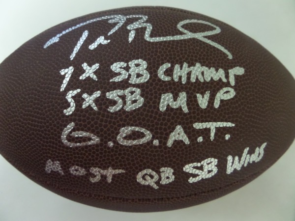 This full size NFL football from Wilson is in NM/MT condition, and comes hand-signed in silver by the greatest of them all, future HOF QB, Tom Brady.  The signature grades an overall 8.5-9, and includes MOST QB SB WINS, G.O.A.T., 5X SB MVP and 7X SB Champ inscriptions, and this football will show off brilliantly in any collection.  Valued into the low thousands!