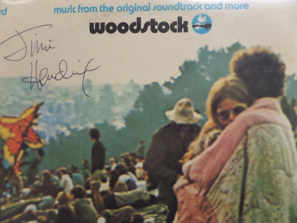 This original "Woodstock: Music From the Original Soundtrack" LP album does not contain the actual records, but is in fabulous, EX/MT condition.  It is front cover-signed in black ink by the man who opened up the final day of the famed festival with his flamboyant rendition of the Star Spangled Banner, the great Jimi Hendrix.  This signature is clean, grading a legible 8.5 at least, and with his tragic death less than a year after this album was released, retail is low thousands!