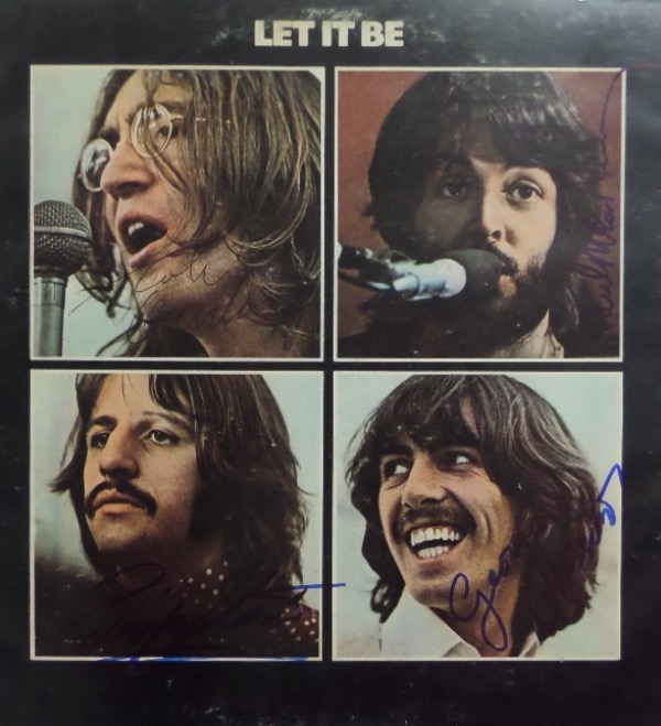 This original 1970 Beatles "Let It Be" LP album is in VG+/EX condition, with color images of The Fab Four on the front.  It is hand-signed in blue sharpie by Paul McCartney, Ringo Starr, and George Harrison and in black ink by John Lennon, with signatures ranging from 6.5's-7's, and with half of the band no longer with us, retail on any album signed by all four is in the five figure range!