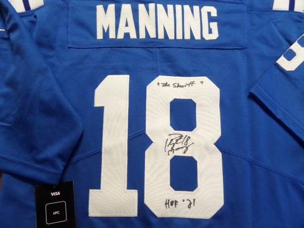 This blue size L Indianapolis Colts #18 Manning jersey from Nike is still new with original tagging attached, and comes with everything professionally-sewn.  It is back number-signed in black  sharpie by the record-smashing passer himself, grading an overall 8, and including 18, "the Shefiff" and HOF '21 inscriptions.  A MUST for the Manning superfan, and retail is mid/high hundreds!