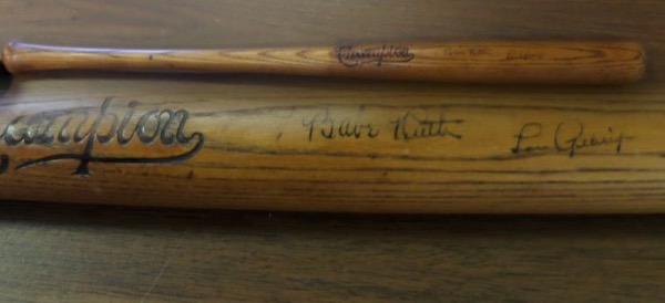 This very old wooden baseball bat from Champion is still in outstanding shape, especially when one considers that it's probably close to 100 years-old.  This one comes hand-signed on the barrel in black fountain pen ink by the greatest pair of teammates in baseball history, Yankees' HOF'ers Babe Ruth and Lou Gehrig.  The signatures here grade 5-6's each, and the bat includes a full LOA from Halper Bros., Inc. for authenticity purposes.  Valued well into the thousands!