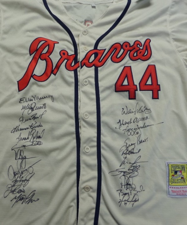 This Hank Aaron #44 custom cream colored XL throwback Braves jersey from Mitchell & Ness is in NM condition, and has everything nicely sewn.  It comes front-signed by no less than TWENTY-ONE different members of the famed 500 Home Run Club, including Murray, Schmidt, Mays, Killebrew, Robinson, Sheffield, McGwire, ARod, Griffey Jr, Thome, Manny, McCovey, Reggie, Banks, Palmiero, Ortiz, Sosa, Pujols, Bonds, Beltre and even Aaron himself!  What a fabulous jersey, and with 5 of the 21 now deceased, retail is into the low thousands!