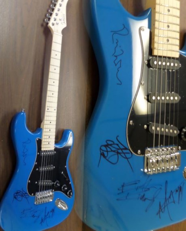 This mint beauty is stunning with a unique look and design to it and comes signed gorgeously by MICK, KEITH, CHARLIE, & RONNIE. Great auto's and guaranteed authentic. Retail is well into the thousands from  1 of the best rock bands of all-time. Ideal for display and comes in original box with carry case, pick-ups,etc! STUNNING!