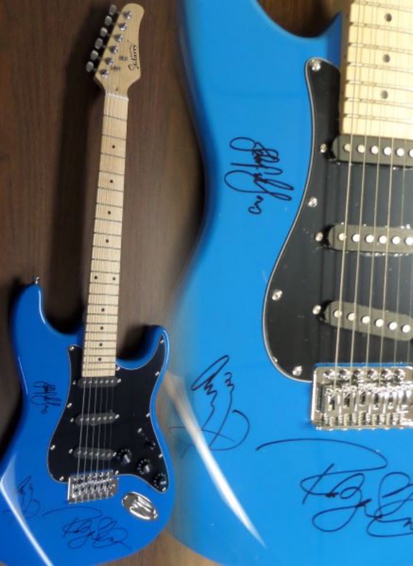 This GORGEOUS mint guitar comes signed on the gem wonderfully in black sharpies by ROBERT PLANT, JIMMY PAGE, & JOHN PAUL JONES!! Signatures are guaranteed authentic and the rare guitar is perfect for framing and showing off. Retails into the thousands easily from 1 of rock's all time best.