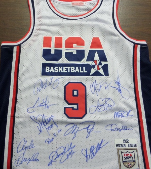 This white size 50 Mitchell & Ness #9 USA Basketball Michael Jordan jersey is in NM/MT condition, with everything sewn, and comes front signed in blue sharpie by by all 12 members of the original Dream Team!  Included are Bird, Magic, Jordan, Barkley, Ewing, Drexler, Robinson, Malone, Stockton, Pippen, Laettner and Mullin, and this AWESOME and one of a kind display item books well into the low thousands!