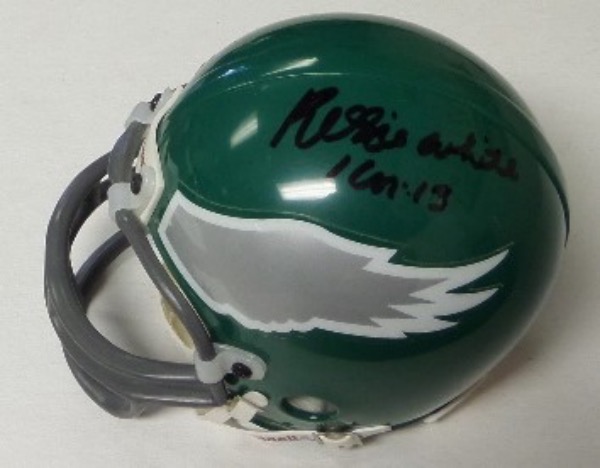 This 1990's green throwback model is just like the one the "Minister of Defense" wore for the Eagles and comes IN PERSON, boldly, black sharpie signed. It grades as new, has his usual Bible Verse added in his deceased hand and best of all, Lee had it signed IN PERSON at the old Vet Stadium. Great piece, guaranteed real for life, and valued at $325.00+ since his death. Reggie was never an EZ signer...