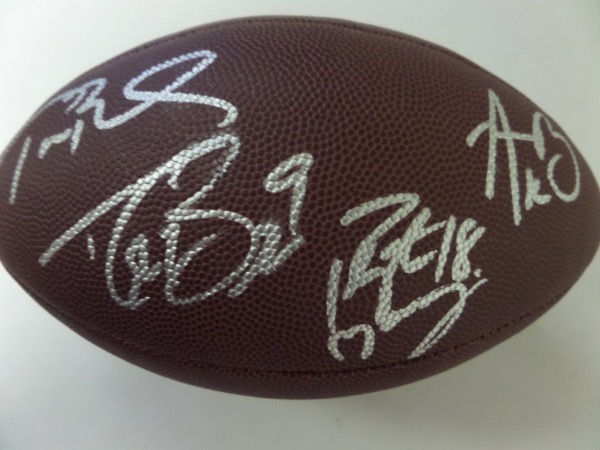 This NM full size NFL football from Wilson comes hand-signed in silver by four of the greatest quarterbacks to ever play the game!  Included are Tom Brady, Drew Brees, Peyton Manning and Aaron Rodgers, with signatures grading 8's-9's, and this wonderful, scintilating ball is valued into the low thousands!
