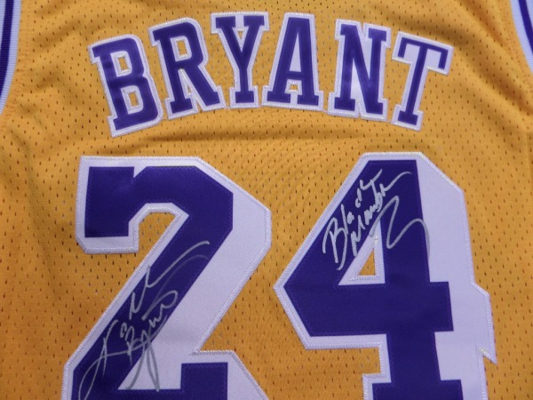 This yellow size L '07/08 Kobe Bryant #24 Los Angeles Lakers throwback M&N jersey is like new, and comes trimmed in purple and white, with everything sewn.  It is hand-signed in his full name on the back number in silver by the all time great himself, as well as a super cool BLACK MAMBA inscription, and with his 2020 death, this amazing looking jersey is valued well into the low thousands!