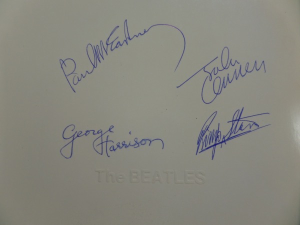 This vintage LP is in great shape, titled "The White Album", and shows all 4 band mates on the color cover. It comes boldly blue ink signed by all 4, grade is a clean bold 10 all over, and of course John, Paul and the rest are here. High value, but sold here with NO reserve! You simply will not find better!