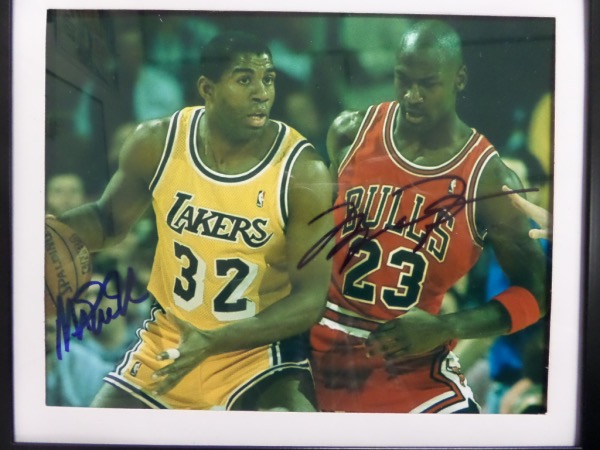 This 1994 era color 8x10 shows both NBA HOF Greats in a Lakers/Bulls contest, on the floor, and in action. It comes boldly blue sharpie signed by both Jordan and Magic, grades a superb 9-10 all over, and comes not only framed to you, but with GFA proper forensic documentation intact. Wow!