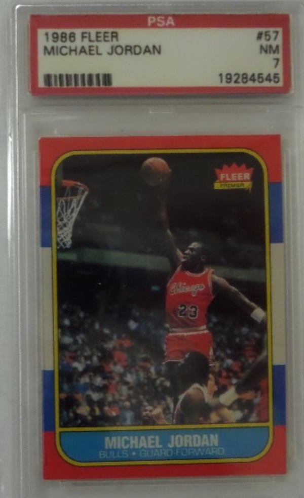 This highly in-demand card shows his airness about to dunk and is 1 of the most popular basketball cards ever.  It comes slabbed and graded by PSA as NM 7. 