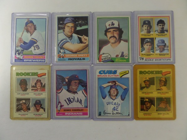 This fantastic and UNIQUE moneymaking opportunity is EIGHT different rookie baseball cards of great players, all in high grade.  Included are a 1976 Topps #98 Dennis Eckersley (EX), a 1977 Topps #144 Bruce Sutter (EX), a '77 Topps #473 Andre Dawson (EX/MT), a a 1977 Topps #476 Dale Murphy (EX) a 1978 Topps #707 Alan Trammell/Paul Molitor (EX), a 1981 Topps #819 Jeff Reardon (NM) a 1976 Topps #19 George Brett (EX) and a 1976 Topps #316 Robin Yount (EX).  AWESOME lot of rookie cards here, and with all but Concepcion in the HOF, retail is high hundreds, easily!