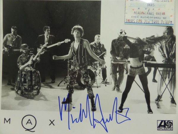 This black and white Max Q Atlantic Records publicity photo is hand-signed in clean blue sharpie by INXS frontman, Michael Hutchence.  The signature is about a 9-9.5, and the photo includes a show ticket from a 1991 INXS concert for provenance.  With Hutchence's death now 25+ years ago, retail is mid hundreds!