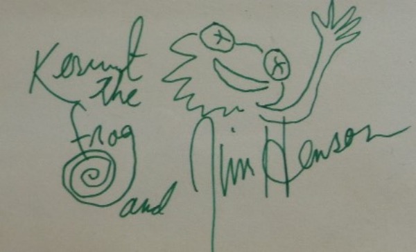 This rarity from 1978 or so is a 3x5 card, unlined, and hand signed by the late Muppets creator. It features a green flair marker sketch of the smart assed frog, his name as well, and value since Hensons death has climbed to upper hundreds online. Their getting harder and harder to find. 