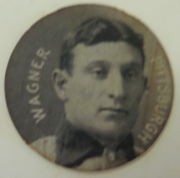 This vintage black and white disc card measures 1.5" in diameter, with an image of a young Honus Wagner on the front, reading WAGNER PITTSBURGH.  On the back is an ad for Colgan's Violet and Mint Chips gum, and on the whole, the disc is really in exceptional, VG+ shape.  A RARE find from 1909, and retail is well into the hundreds!