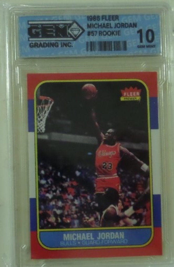 This super high value investment card grades a gem mint 10 says "Gem Grading Co." and value is sky high on the 1986 Fleer #57 rookie card of the greatest ever. It is slabbed, shows Mike in mid-dunk, and belongs in every serious card collection. 